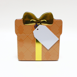Unsere Produkte: Schmuckdose Geschenkdose orangenes Muster mit goldener stilisierter Schleife, Weißblechdose Draufsicht stehend